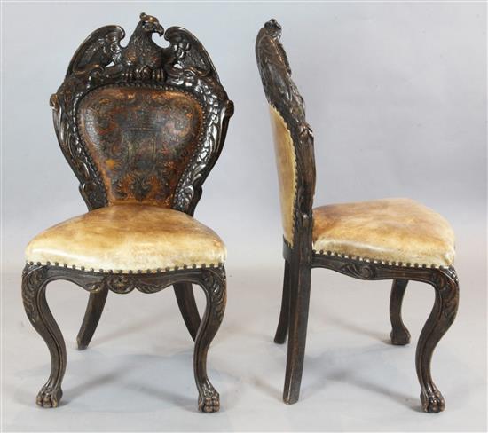 A pair of 19th century German carved walnut salon chairs, H.3ft 7in.